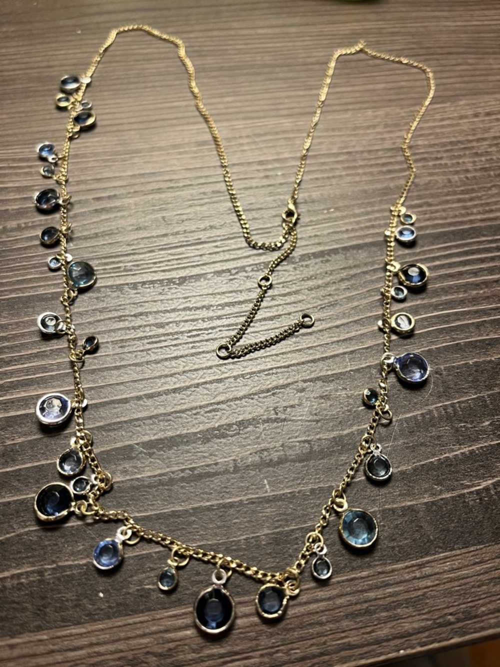Unbranded tiny blue crystal beads framed in gold tone holder long necklace.
